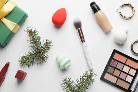 Christmas composition with cosmetics on white backgroundの写真素材