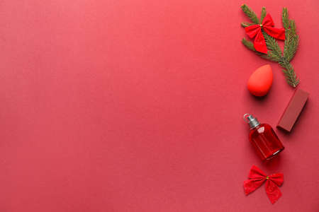 Christmas composition with cosmetics on color backgroundの写真素材