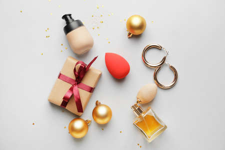 Christmas composition with cosmetics on white backgroundの写真素材