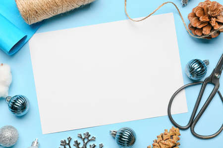 Beautiful Christmas composition with blank card on color backgroundの写真素材