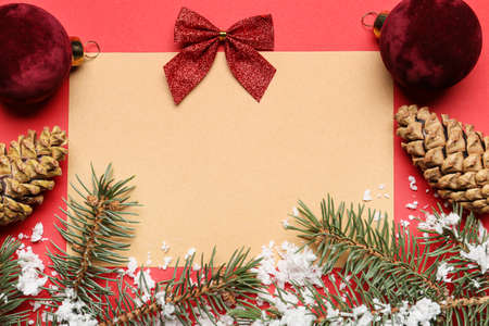 Beautiful Christmas composition with blank card on color backgroundの写真素材