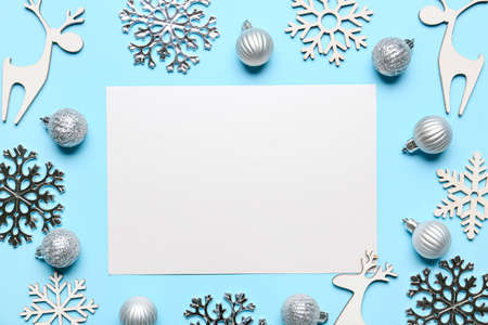 Beautiful Christmas composition with blank card on color backgroundの写真素材
