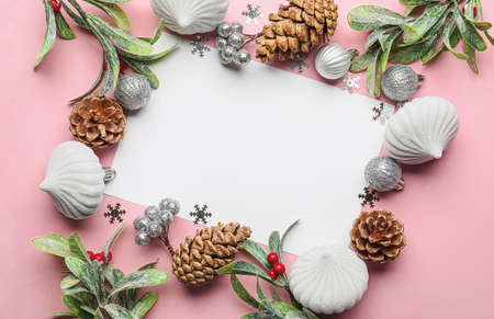 Beautiful Christmas composition with blank card on color backgroundの写真素材