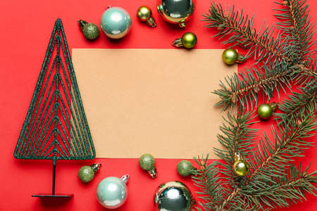 Beautiful Christmas composition with blank card on color backgroundの写真素材