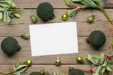 Beautiful Christmas composition with blank card on wooden backgroundの写真素材
