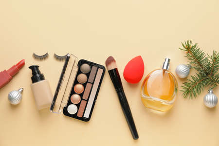 Christmas composition with cosmetics on color backgroundの写真素材