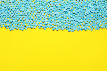 Sweet sprinkles on color backgroundの写真素材