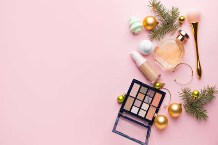 Christmas composition with cosmetics on color backgroundの写真素材