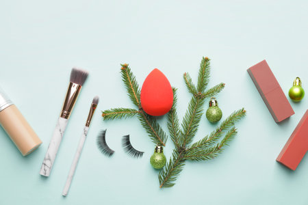 Christmas composition with cosmetics on color backgroundの写真素材
