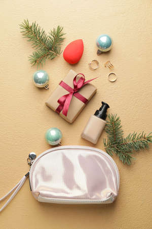 Christmas composition with cosmetics on color backgroundの写真素材