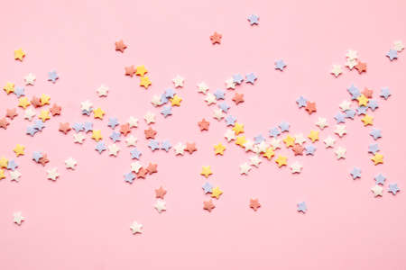 Sweet sprinkles on color backgroundの写真素材