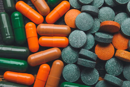 Different pills as background, closeup