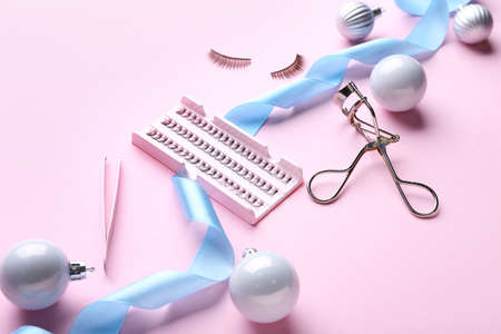 Christmas composition with cosmetics on color background