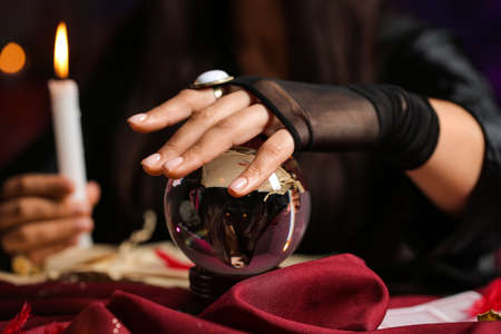 Fortune teller with crystal ball reading future, closeupの写真素材