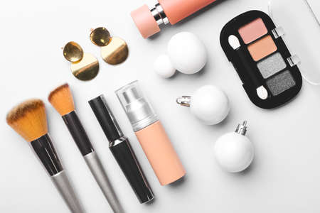 Christmas composition with cosmetics on white backgroundの写真素材