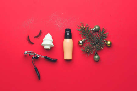 Christmas composition with cosmetics on color backgroundの写真素材
