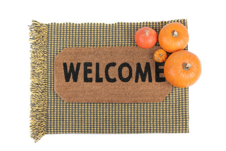 Doormat with pumpkins and plaid on white backgroundの写真素材