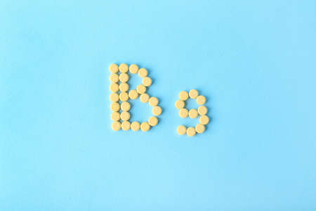 Text B9 made of folic acid pills on color backgroundの写真素材