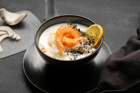 Bowl with Thai rice soup on dark backgroundの写真素材