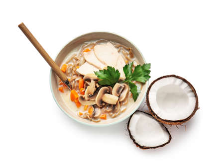 Bowl with Thai chicken noodle soup on white backgroundの写真素材