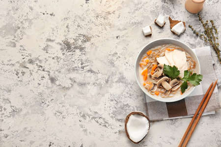 Bowl with Thai chicken noodle soup on grunge backgroundの写真素材