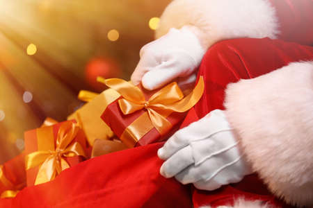 Santa Claus with bag full of Christmas gifts, closeupの写真素材