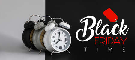 Alarm clocks with text BLACK FRIDAY TIME on dark and light background
