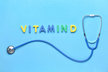 Text VITAMIN D with stethoscope on color backgroundの写真素材