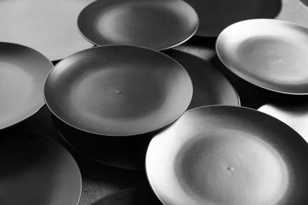 Many stylish plates as backgroundの写真素材
