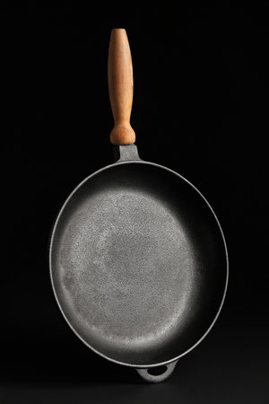Frying pan on dark backgroundの写真素材