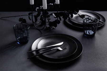 Stylish table setting on dark background