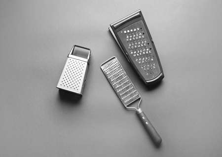 Different graters on dark backgroundの写真素材