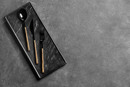 Stylish cutlery on dark backgroundの写真素材