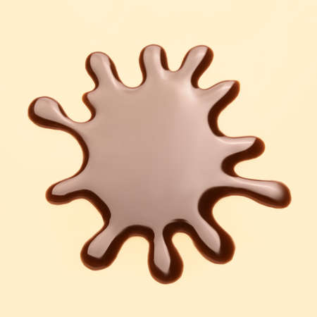 Spilled liquid chocolate on color backgroundの写真素材
