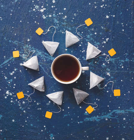 Composition with tea bags on color background
