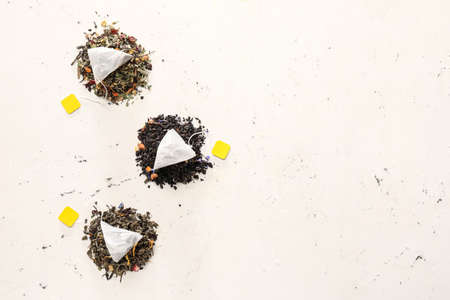 Composition with tea bags on light background