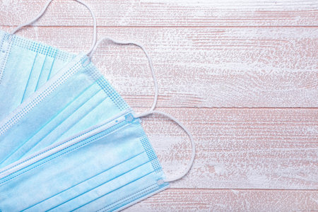 Medical masks on wooden backgroundの写真素材