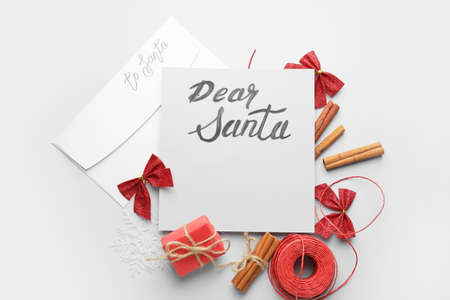 Blank letter to Santa and Christmas decor on white backgroundの写真素材
