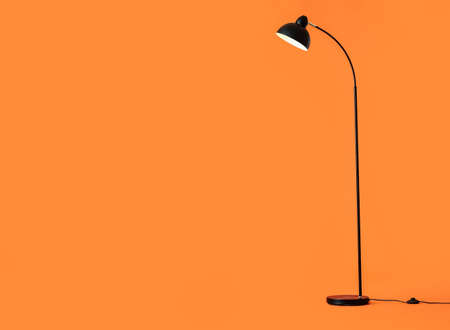 Modern floor lamp on color backgroundの写真素材