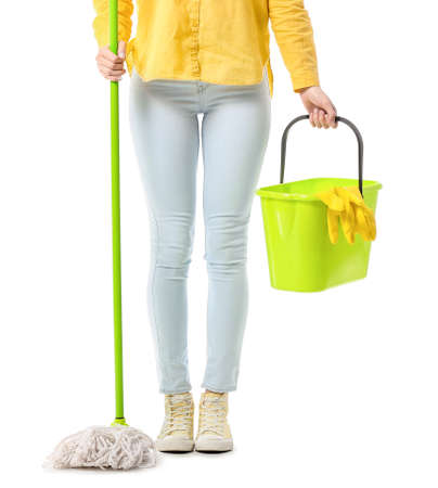 Young woman with floor mop and bucket on white backgroundの写真素材