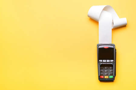 Payment terminal on color background