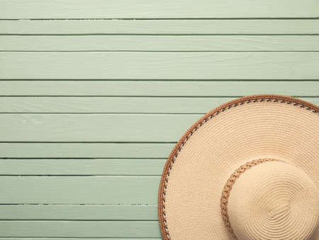 Stylish hat on color wooden backgroundの写真素材