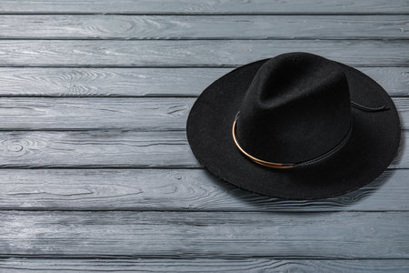 Stylish hat on dark wooden backgroundの写真素材