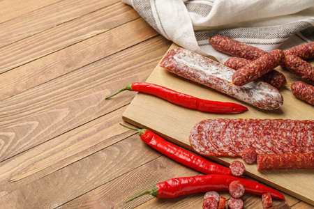 Tasty sausages on wooden backgroundの写真素材