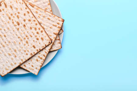 Plate with Jewish flatbread matza for Passover on color backgroundの写真素材