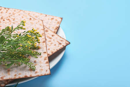Plate with Jewish flatbread matza for Passover on color backgroundの写真素材