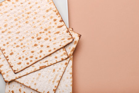 Plate with Jewish flatbread matza for Passover on color backgroundの写真素材