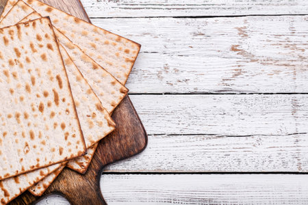 Jewish flatbread matza for Passover on wooden backgroundの写真素材
