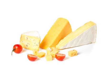 Different types of cheese and tomatoes on white background
