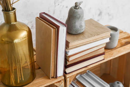 Stack of books on wooden boxes, closeup